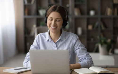 business continuity plan - woman talking on computer with headphones